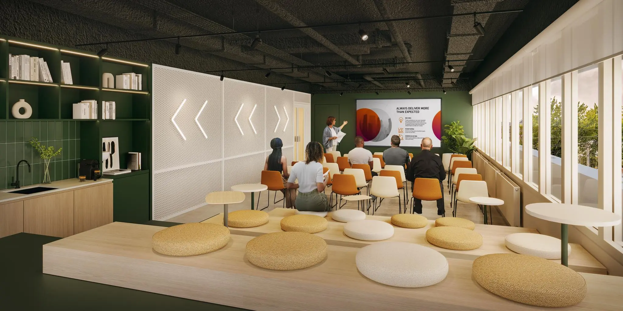 Moderne presentatieruimte aan de Marten Meesweg met zitplaatsen, keukenhoek en spreker voor een scherm.